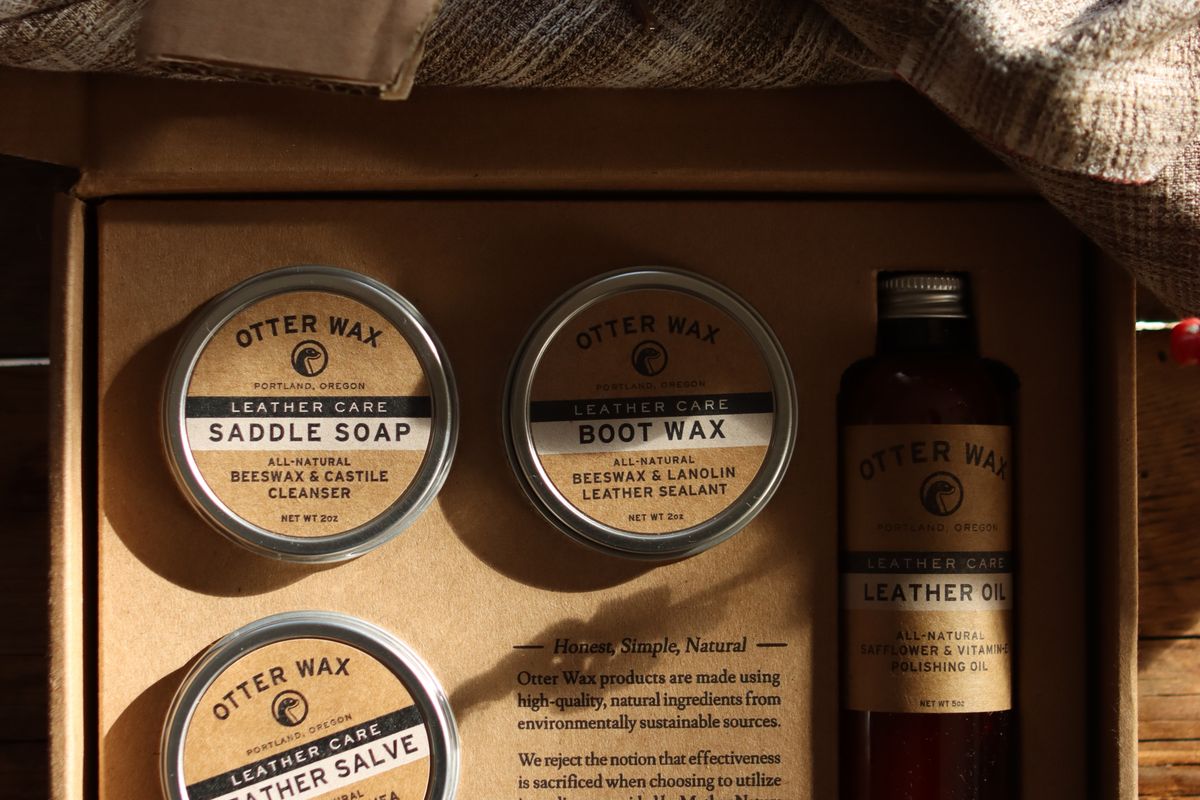 A natural leather bag being treated with conditioner beside a small test patch